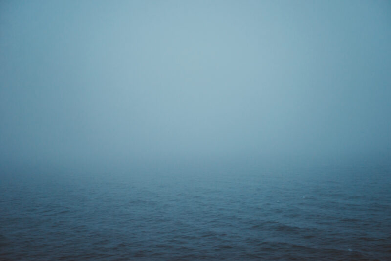 Thick fog over dark waters