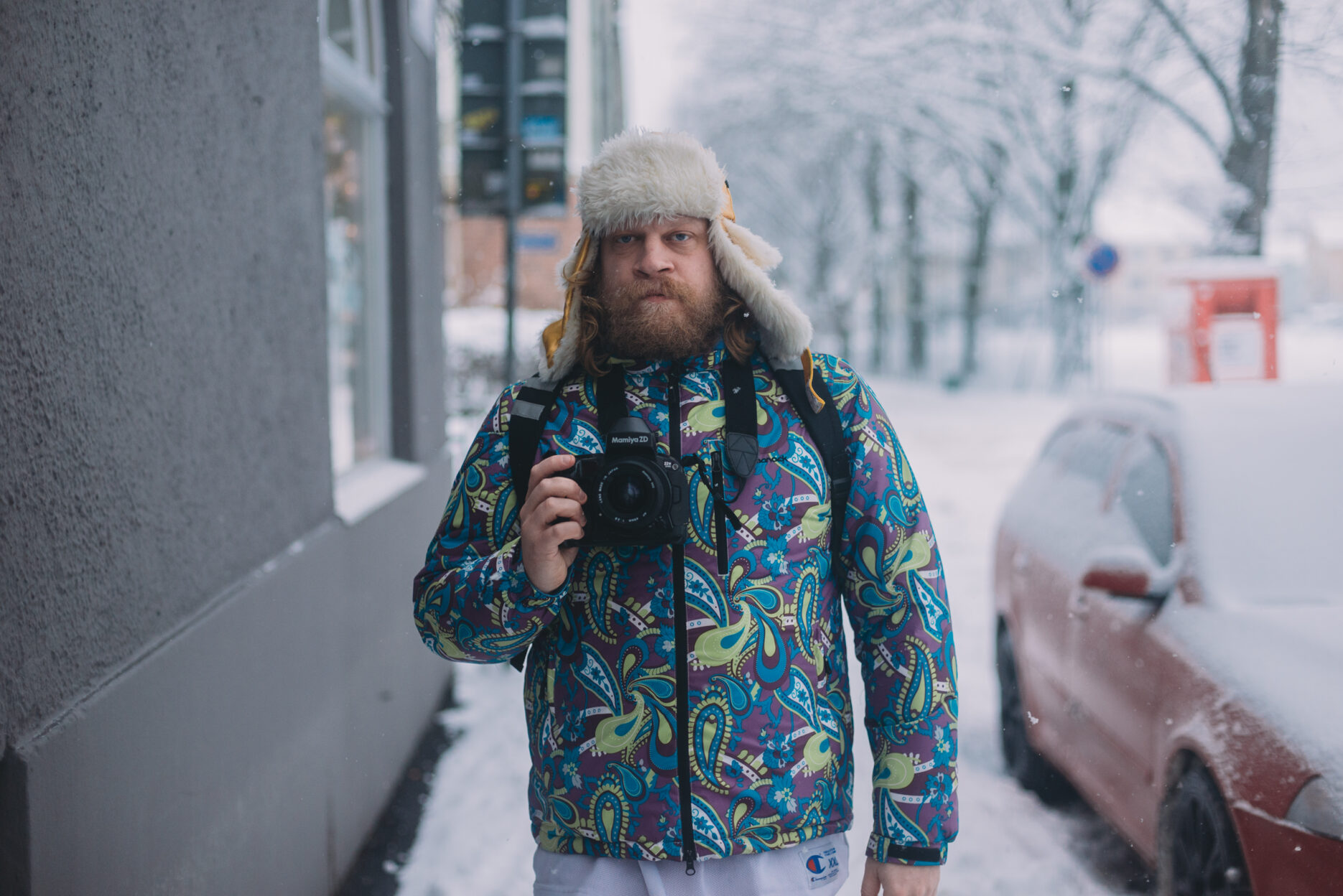 Man in winter clothing standing on snowy street
