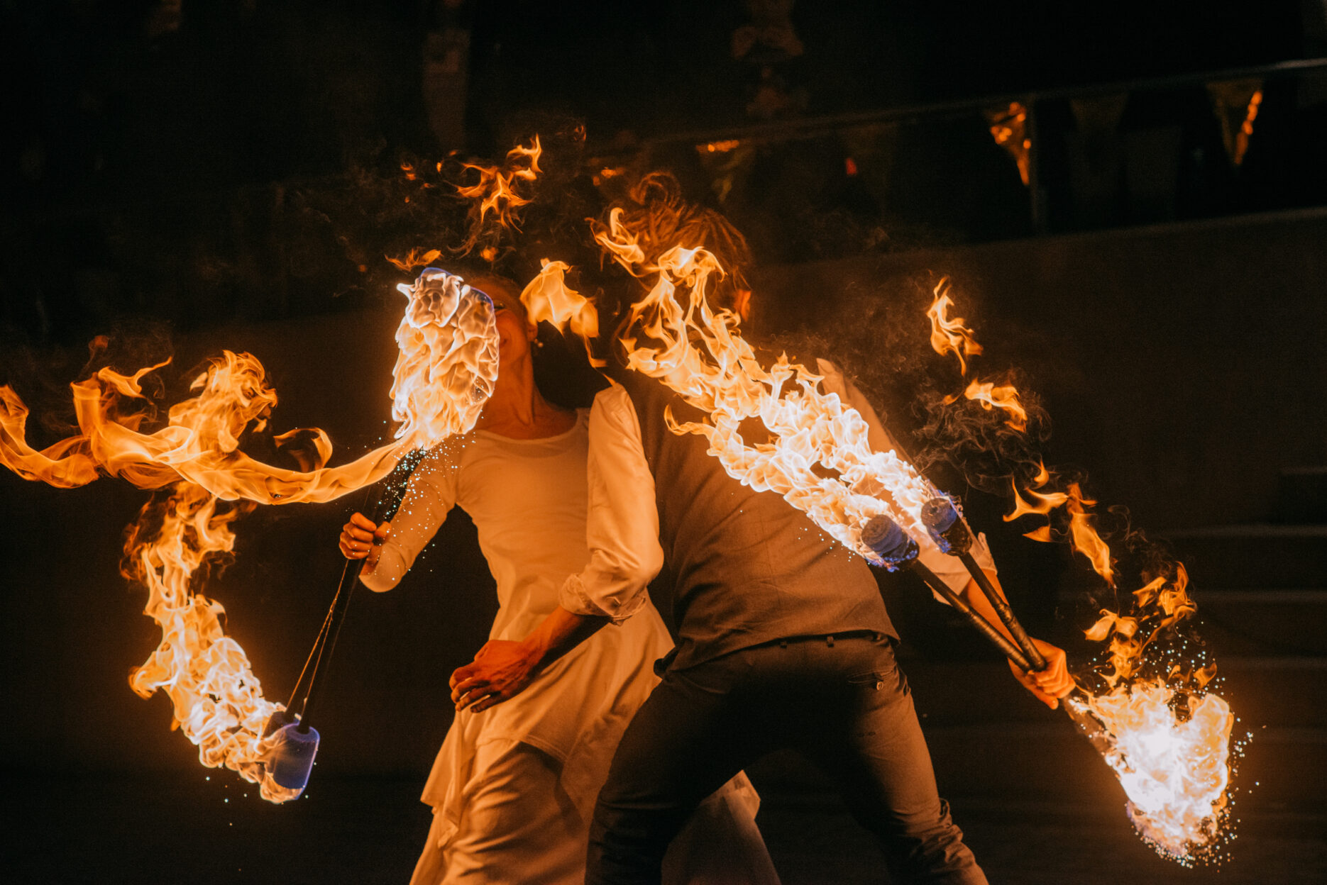 Two fire artists performing