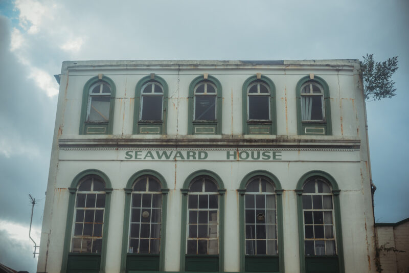 Old white building with the name Seaward House written on it