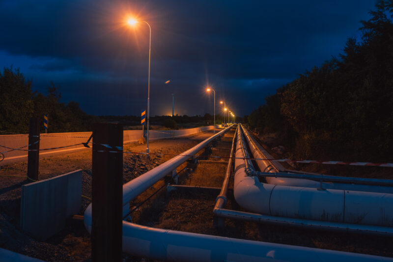 Industrial pipes leading into the horizon